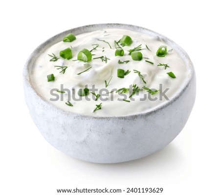 White ceramic bowl of fresh sour cream dip sauce with herbs isolated on white background Royalty-Free Stock Photo #2401193629