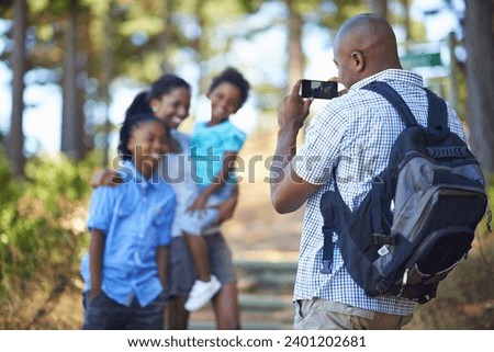 Picture, happy or black family hiking in forest to relax or bond on holiday vacation in nature. Children siblings, mother or African father in woods trekking on outdoor adventure with smile for photo