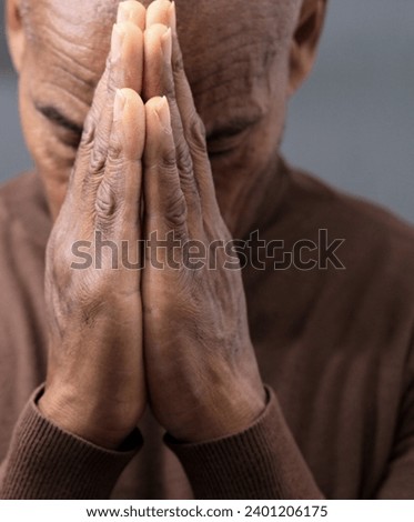 praying to god on gray black background with people stock image stock photo