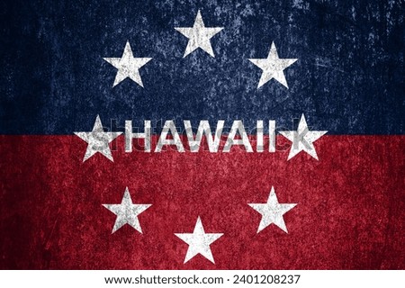 Close-up of the grunge Hawaii state flag. Dirty Hawaii state flag on a metal surface.