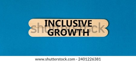 Inclusive growth symbol. Concept words Inclusive growth on beautiful wooden stick. Beautiful blue table blue background. Business inclusive growth concept. Copy space.