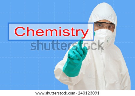 scientist in safety suit pointing to word chemistry