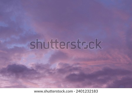 Lilac and blue clouds at sunset