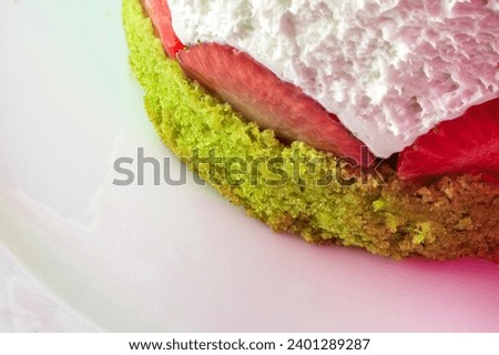 Strawberry and pistachio cake with fresh berries and whipped cream, macro image. Gourmet desserts concept idea. Great delicious cream desserts.