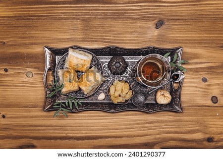 Ramadan table top view. Banner with traditional cup of tea, dishes and food sets