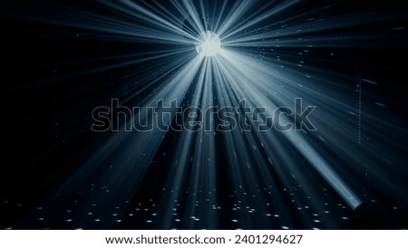 Disco Ball Shining Brightly with Rays of Light at Nightclub Royalty-Free Stock Photo #2401294627