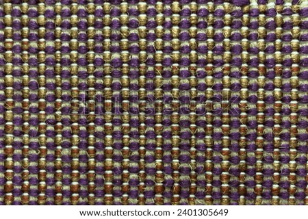 Textured small checkered pattern on fabric for background.