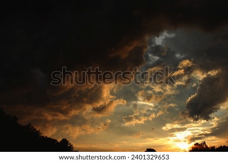 Sunset sky with dark clouds