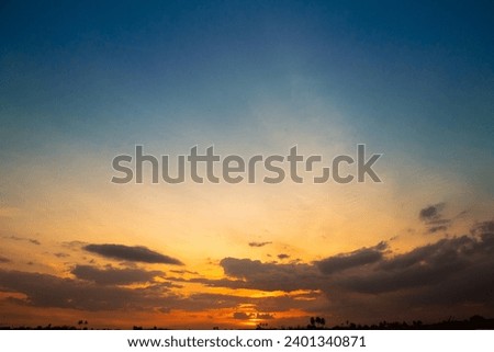 full sky with blue color along with clouds, Full sky in yellow color with rising of sun, Combination of blue and yellow sky Royalty-Free Stock Photo #2401340871