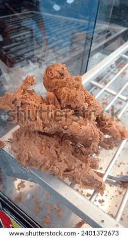 Photo of deep fried chicken neck with breading sold at a street food stall