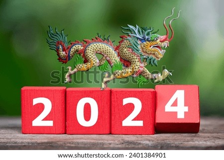 2024 on red wood and dragon on nature background.Merry Christmas and Happy New Year. new year concept..