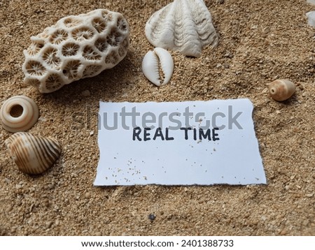 Real time writing on beach sand background.