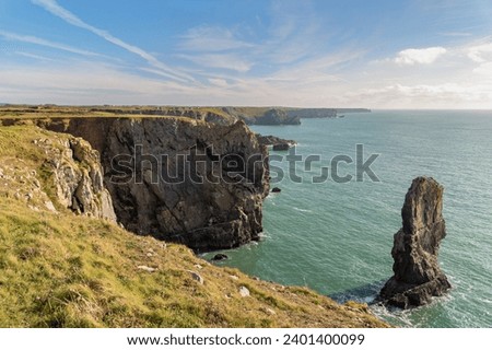 Coast at the Green Bridge of Wales near Castlemartin and Merrion in Pembrokeshire, Wales, UK Royalty-Free Stock Photo #2401400099