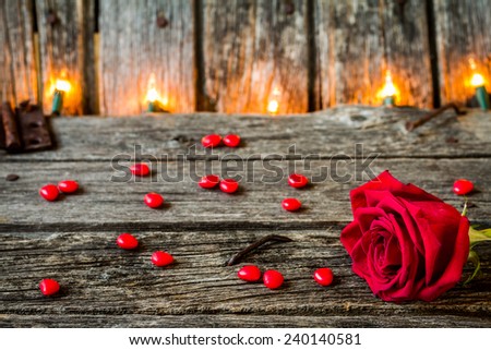 Red Rose with Rustic Old Barn Wood with Lights and Red Candy Hearts