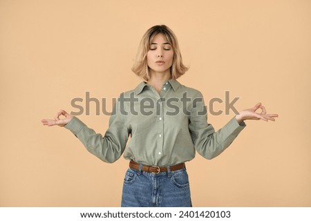 Calm pretty gen z blonde young woman, serene girl with short blond hair meditating with eyes closed feeling stress free peaceful mind standing isolated on beige background. Mental health care concept.