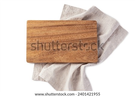 Wooden board on natural linen napkin isolated on white background, top view