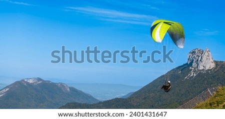 Paragliders above Lake Annecy, in autumn, in Haute Savoie, France