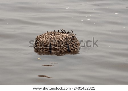 Hancrafted basket in a river