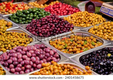 Olives of different colors and tastes in an assortment at an oriental bazaar