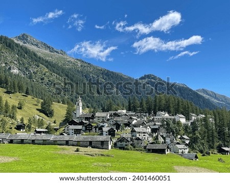 a small village with a mountain in the background