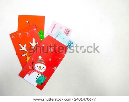 Christmas theme envelope with Indonesian money or Rupiah inside