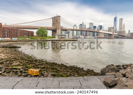 The Brooklyn Bridge with Manhattan skyline and East River.