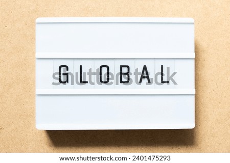 Lightbox with word global on wood background