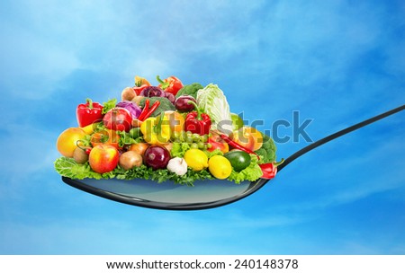 Spoon full of various fruit and vegetables Royalty-Free Stock Photo #240148378
