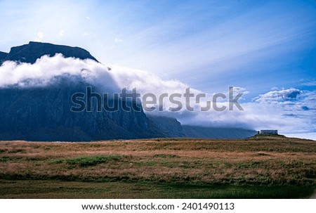A cloud embraces the mountain