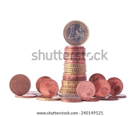 1 Euro coin standing on top of stack of euro coins surrounded by smaller value standing coins. Symbol for economy, business, income, banking, finance, leadership, progress