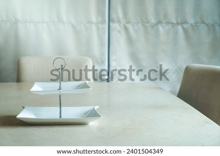 empty white plate on dining table