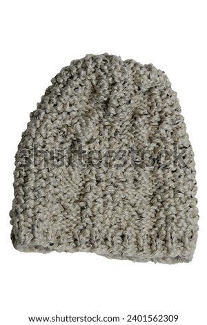 Knitted white grey hat isolated on white background. Winter gray woolen hat with isolated on a white background. Fashionable womens hat.