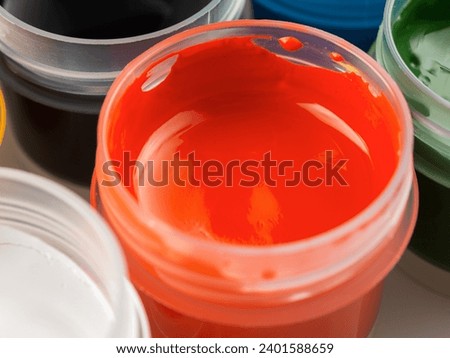 Jars of acrylic gouache paint art painting creativity and development close-up
