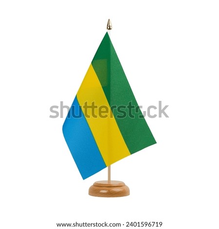 Gabon Flag, small wooden gabonese table flag, isolated on white background Royalty-Free Stock Photo #2401596719