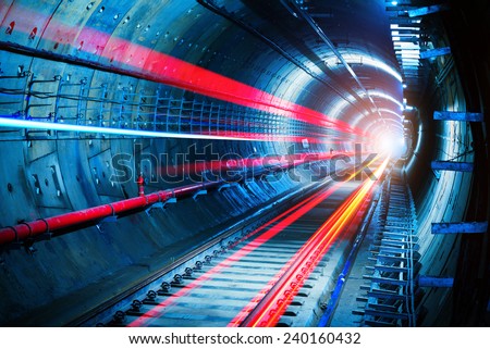 Light trails in the subway tunnel Royalty-Free Stock Photo #240160432