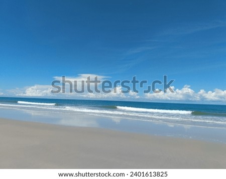 the tranquility of the beach with the beautiful bluesky