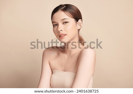 Beautiful young asian woman with clean fresh skin on beige background, Face care, Facial treatment, Cosmetology, beauty and spa, Asian women portrait. Royalty-Free Stock Photo #2401638725