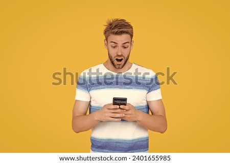 digital communication of surprised man with phone. man uses his phone to text making communication easy and convenient. man uses phone to make effective communication. man has phone communication