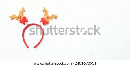 cute Christmas headbands with christmas reindeer horns isolate on a white backdrop. concept of joyful Christmas party,New year is coming soon, festive season decoration with Christmas elements