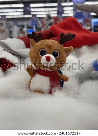 A Christmas Reindeer toy with scarf 