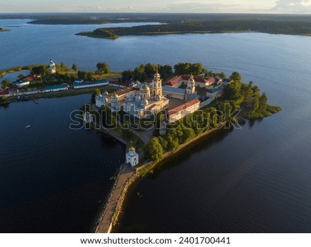 View from the height on the ancient monastery Nilo-Stolobenskaya desert sunny July evening. Tver region, Russia