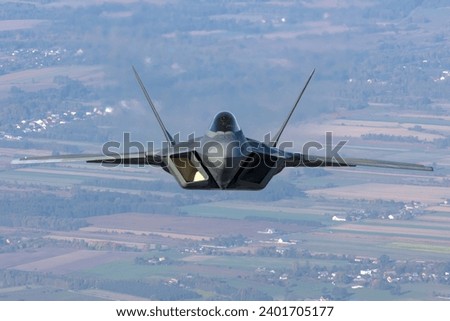 US Air Force F-22 RAPTOR fighter jets overhead Poland Royalty-Free Stock Photo #2401705177
