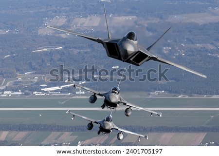 US Air Force F-22 RAPTOR fighter jets overhead Poland Royalty-Free Stock Photo #2401705197
