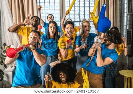 Multiethnic joyful sport fans watching game on TV at home - Supporters having fun on sofa for competition event on TV - Friends celebrating victory when sport team wins worlds championship