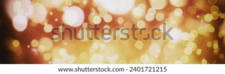 Abstract light celebration background with defocused golden lights for Christmas, New Year, Happy New Year. Royalty-Free Stock Photo #2401721215