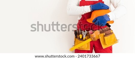 man and tools in leathern belt Royalty-Free Stock Photo #2401733667
