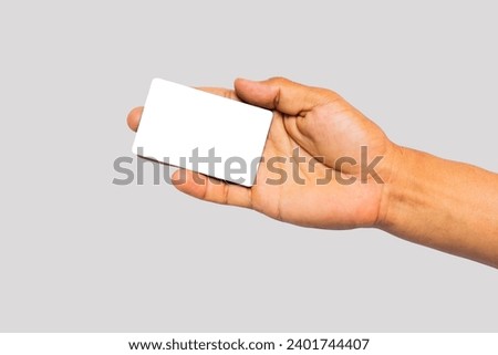 Male hand holding a credit card or business card isolated on white background, clipping path