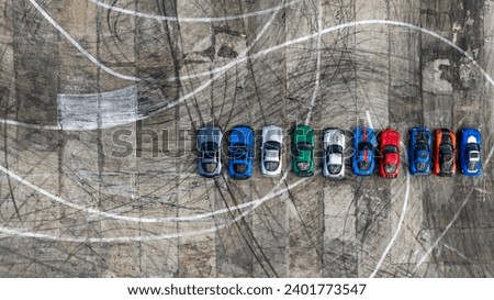 Aerial view super car show on track with tire track skid mark, Top view super car on asphalt road, Top view of sports car on asphalt road. Royalty-Free Stock Photo #2401773547