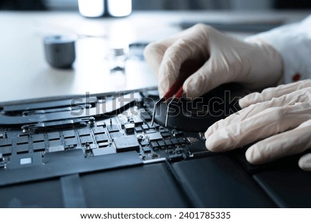 computer warranty guarantee, hands work with computer components Royalty-Free Stock Photo #2401785335
