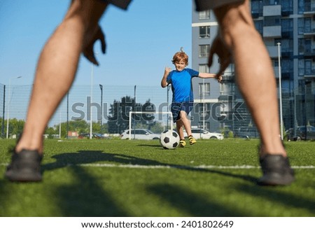 Father and son organizing family football summer camp at city stadium Royalty-Free Stock Photo #2401802649